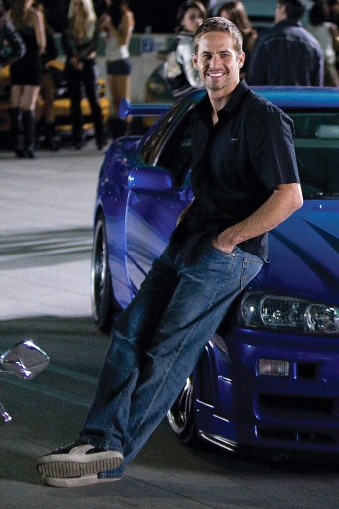 Paul Walker smiling warmly in a candid photo, remembered for his role as Brian O’Conner in Fast & Furious, honoring his life after his tragic death in 2013.