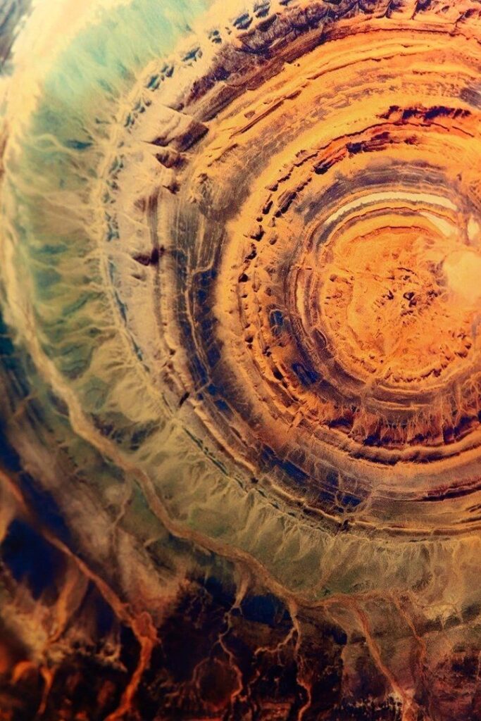 Aerial view of the Richat Structure showing circular rock formations in the Mauritanian desert.