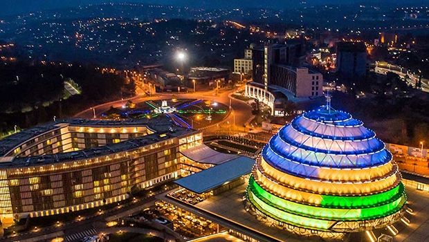 A panoramic view of Kigali city with the Kigali Convention Center and Radisson Hotel prominently visible, highlighting the city’s skyline and urban development.