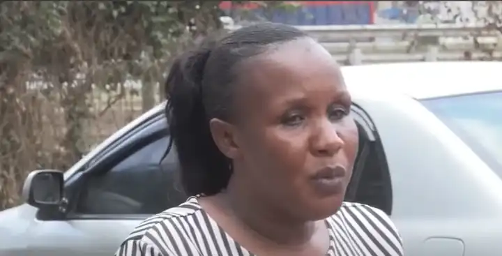 A heartbroken Nairobi mother wipes away tears as she mourns the loss of her daughter, Rose Muthoni.