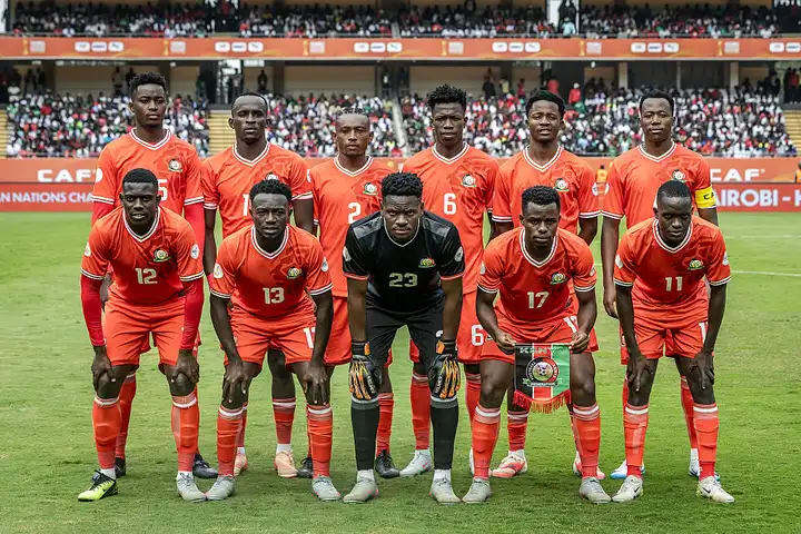 Harambee Stars players celebrating together after an international match.